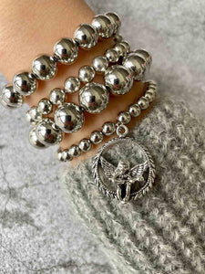 Silver stack with angel charm